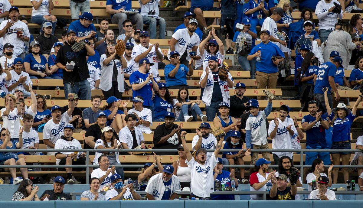 Dodger fans cheer the home team on reopening night at Dodger Stadium.