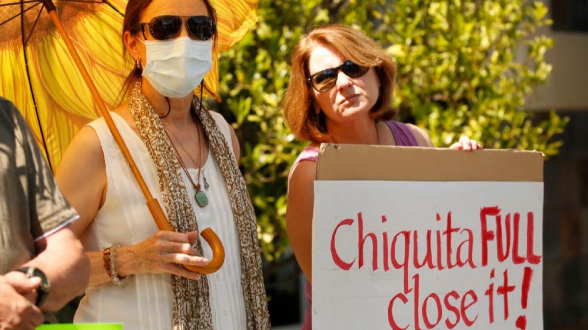 Protesters outside Supervisor Michael Antonovich's office in Santa Clarita call for the closure of the Chiquita Canyon Landfill.