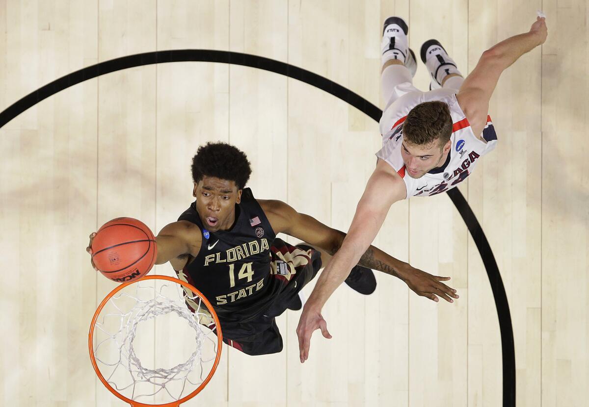 Florida State guard Terance Mann drives past Gonzaga forward Corey Kispert during the second half of their Sweet 16 game.