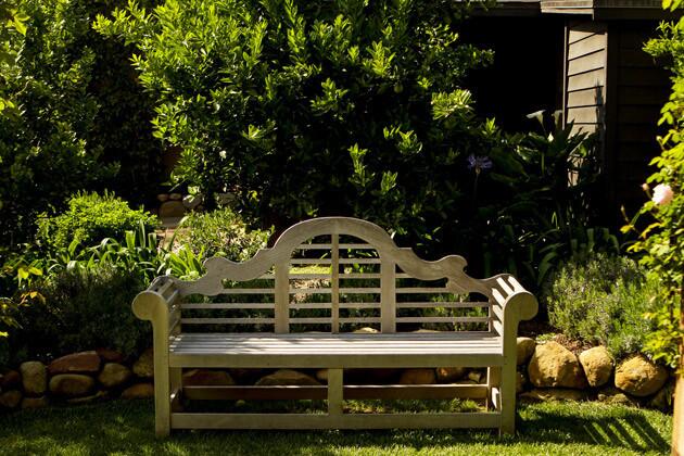 At the end of the pergola is a classic Edwin Lutyens teak bench that offers a cozy place to take in the fragrance of nearby citrus trees ¿ tangerine, lemon and lime.