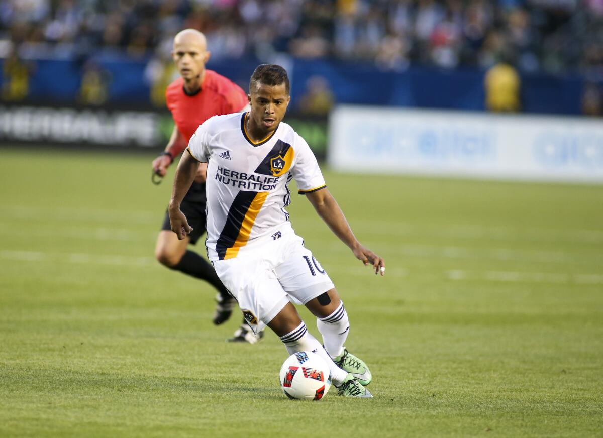 Galaxy forward Giovani dos Santos (10) works against the Timbers during a game on April 10 at StubHub Center.