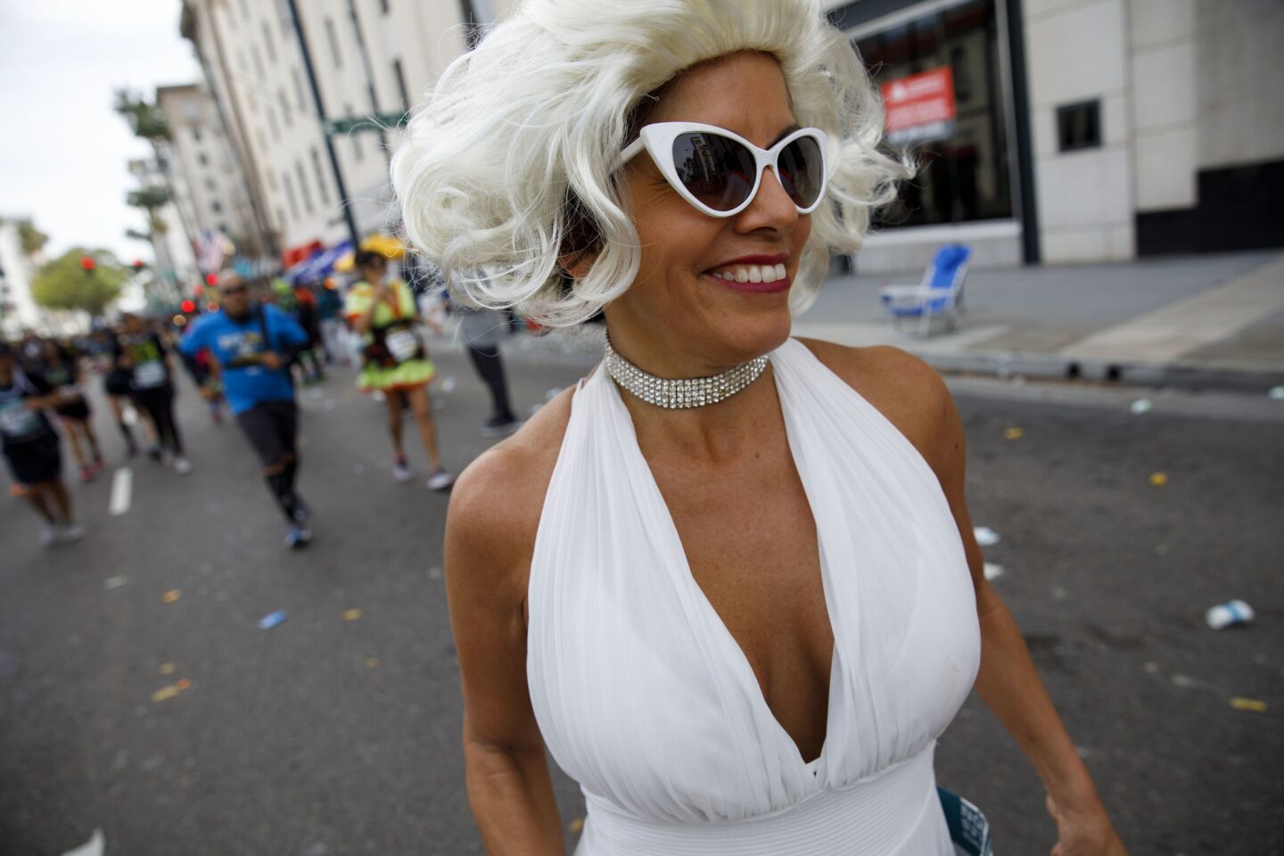 An Marilyn Monroe impersonator runs past mile 17 in the L.A. Marathon in Beverly Hills.