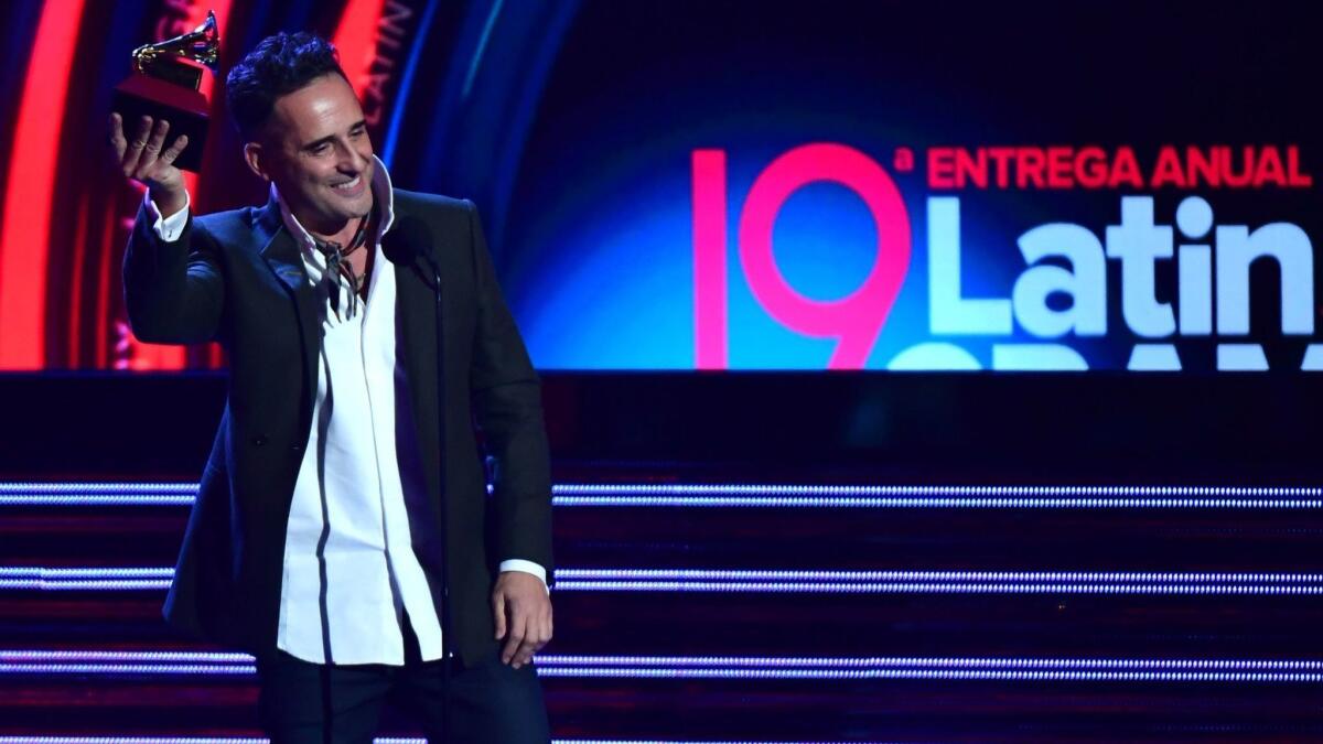 Uruguay's Jorge Drexler accepts the record of the year award for 'Telefonia' during the 19th Annual Latin Grammy Awards in Las Vegas.
