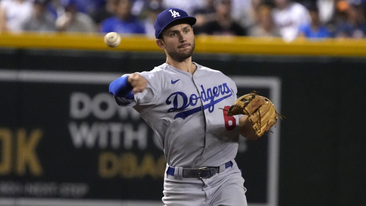 Dodgers shortstop Trea Turner throws to first against the Arizona Diamondbacks on Monday.