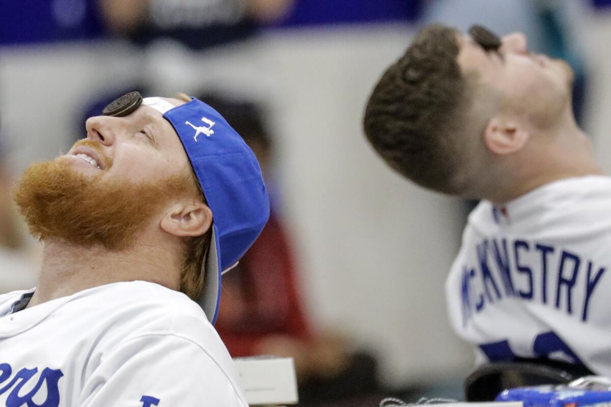 Dodgers teammates Justin Turner, left, and Zach McKinstry play a game during a pep rally at Saugus High School in Santa Clarita on Friday.