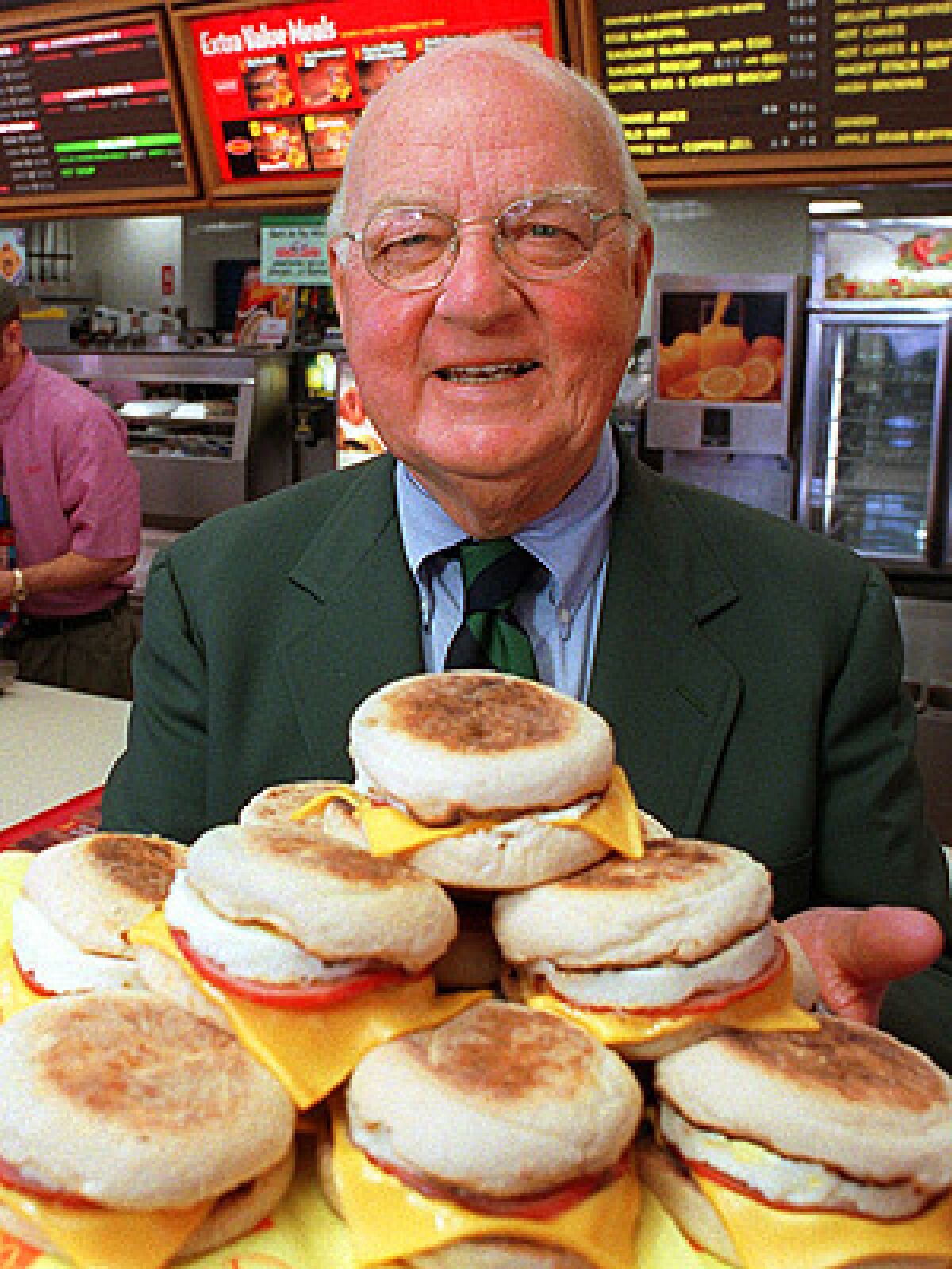 Herb Peterson, the creator of the Egg McMuffin, shows off his invention in this April 1997 file photo, at one of his McDonald's franchises in Santa Barbara, Calif.