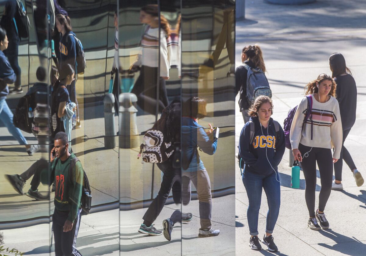 Students walk near the entrance to the Geisel Library at the UCSD campus on Wednesday, November 6, 2019 in San Diego, California.