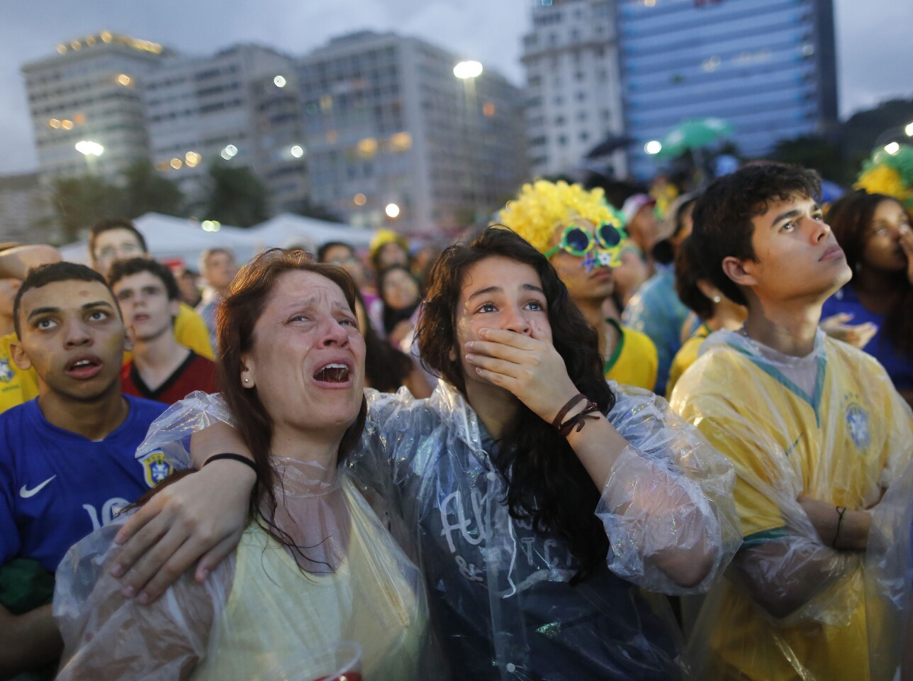 Brazilian soccer fans can't hide their shock at the FIFA Fan Fest area in Rio de Janeiro.