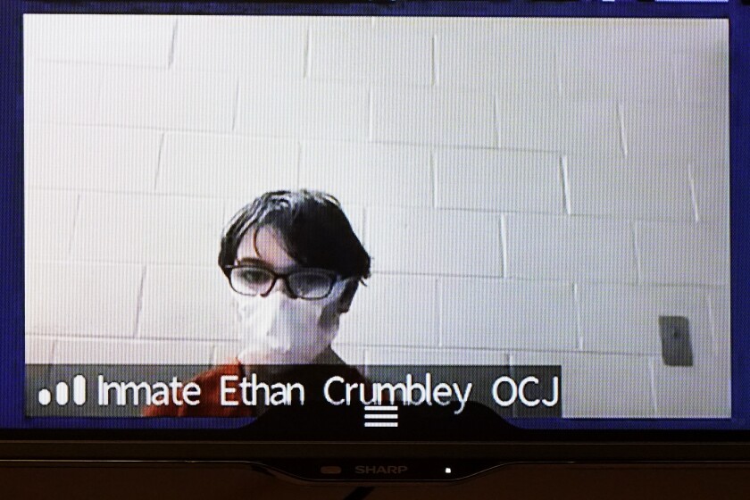 Ethan Crumbley appears on video from the Oakland County Jail at 52nd District Court in Rochester Hills, Mich., Monday, Dec. 13, 2021. Crumbley, 15, is charged as an adult with murder, terrorism and other counts for the Nov. 30 shooting at Oxford High School, about 30 miles (50 kilometers) north of Detroit. (AP Photo/Paul Sancya)