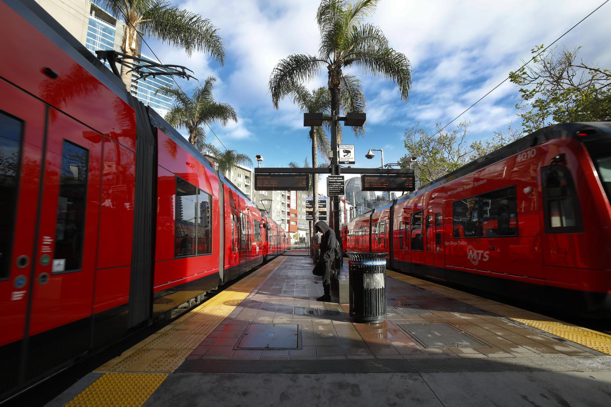 On Wednesday April 8, 2020, two almost empty trolley trains arrived and departed from the 12th and Imperial Transit Center in downtown, San Diego.