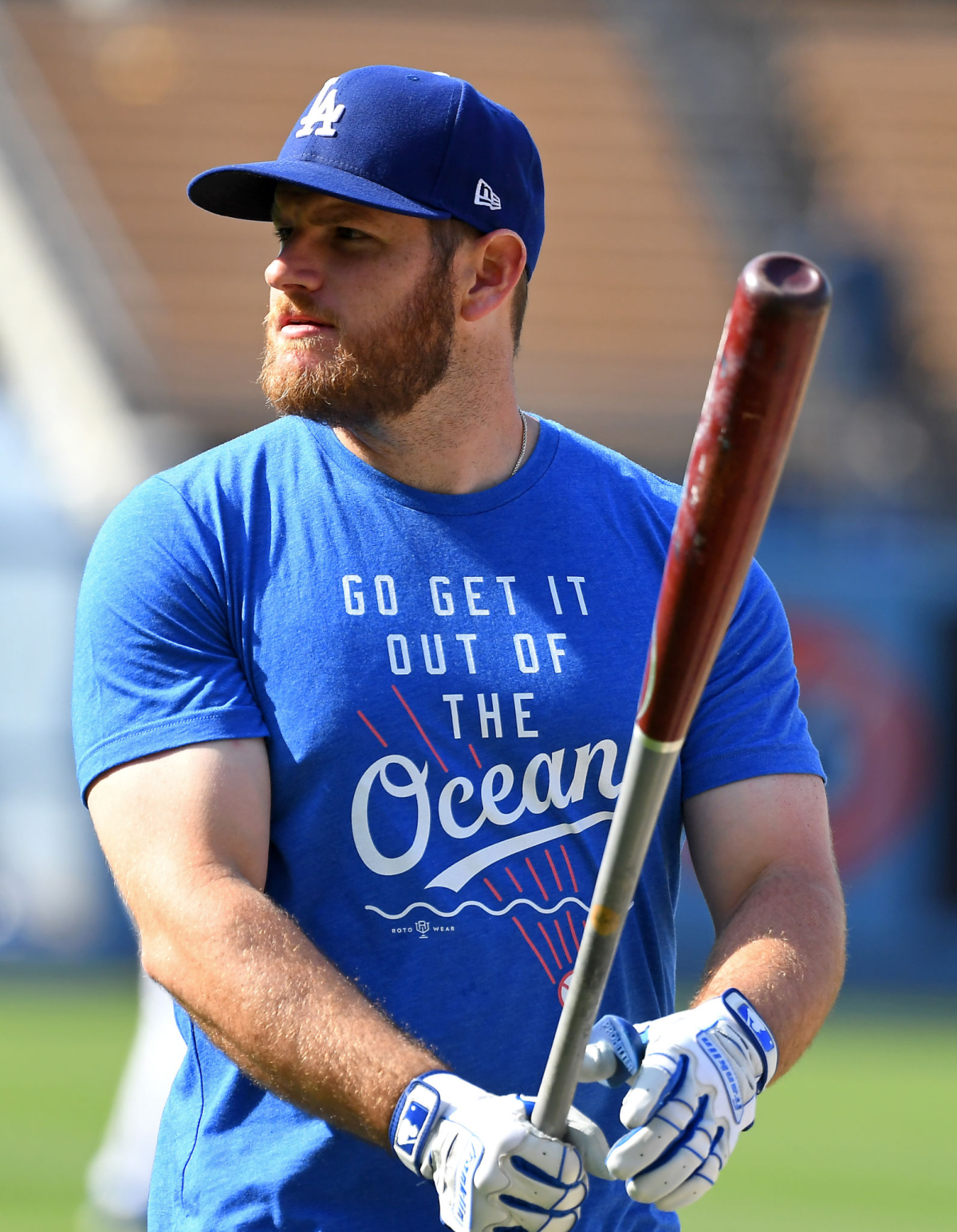 Dodgers infielder Max Muncy wears a T-shirt during batting practice in 2019.