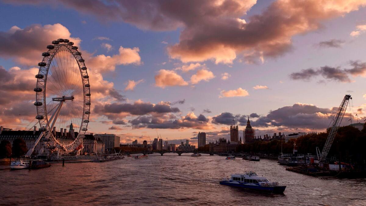 The London Eye, and the Houses of Parliament are pictured as the sun sets over River Thames. Cheapflightsfinder.com found a round-trip fare from San Francisco to London for $367.