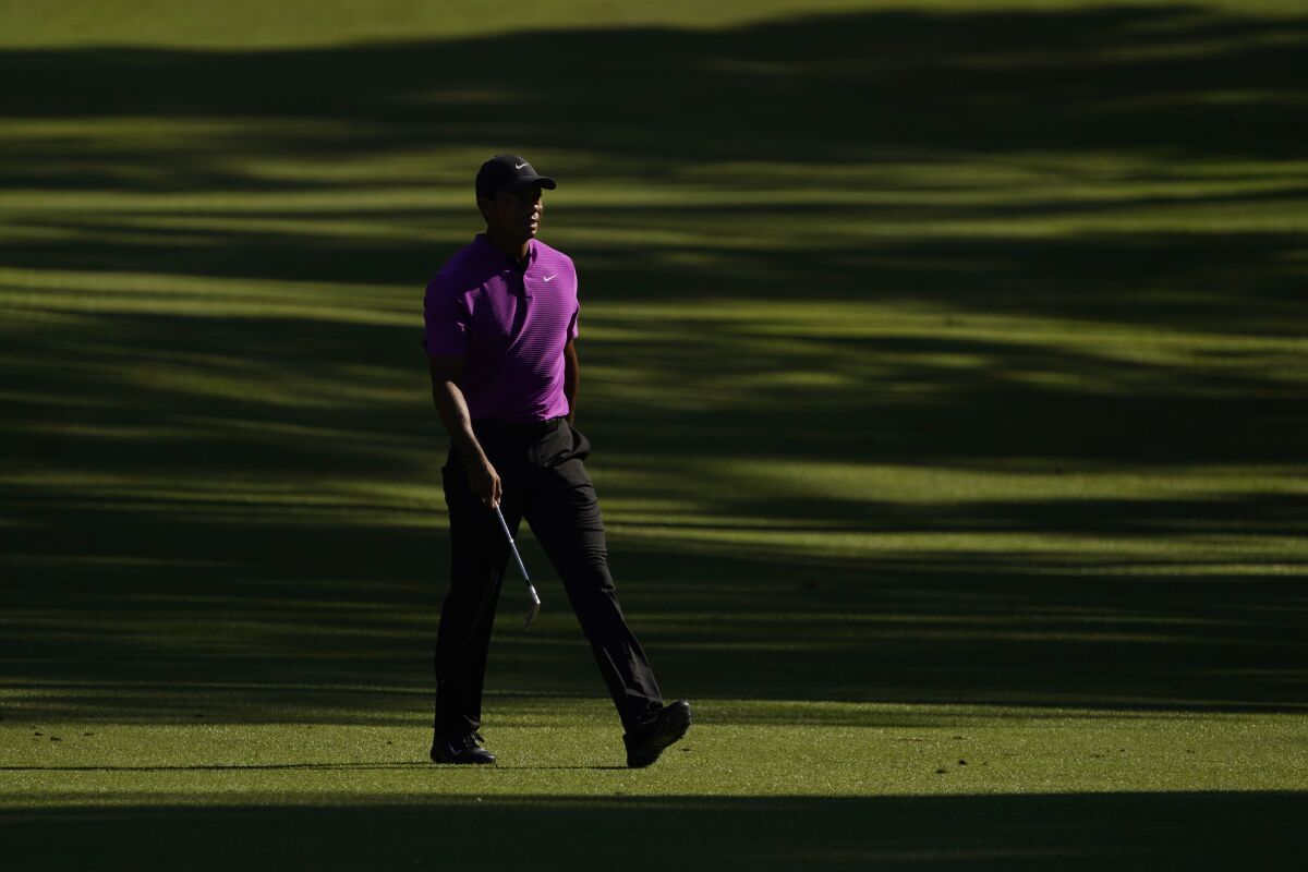 Tiger Woods walks on the 13th fairway during the third round of the Masters on Saturday.