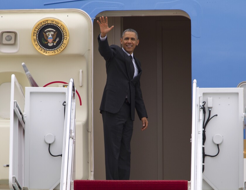 President Obama waves from Air Force One before departing at Andrews Air Force Base on Wednesday.