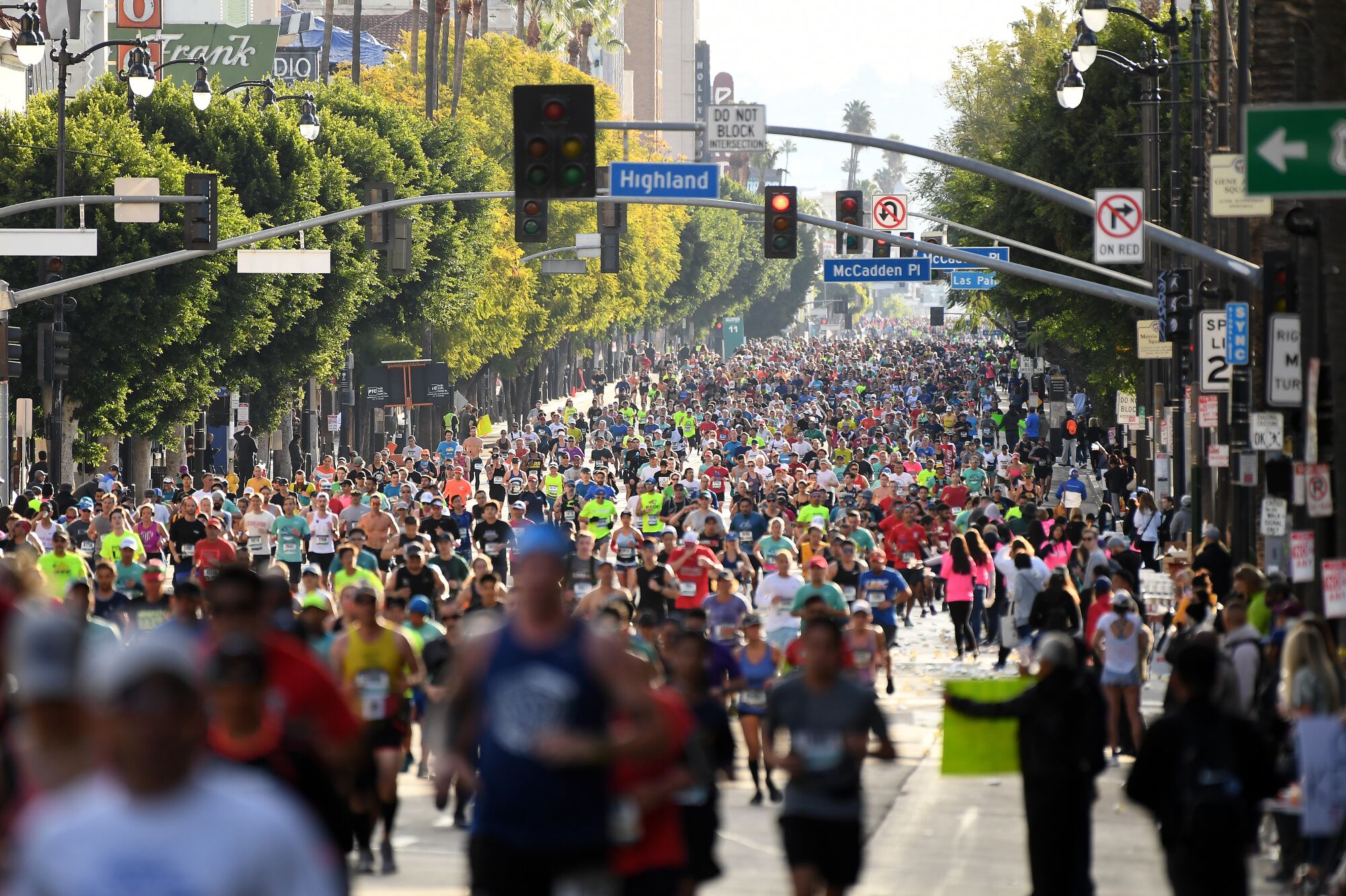 LOS ANGELES, CALIFORNIA MARCH 8, 2020-Runners jog along Hollywood Blvd.