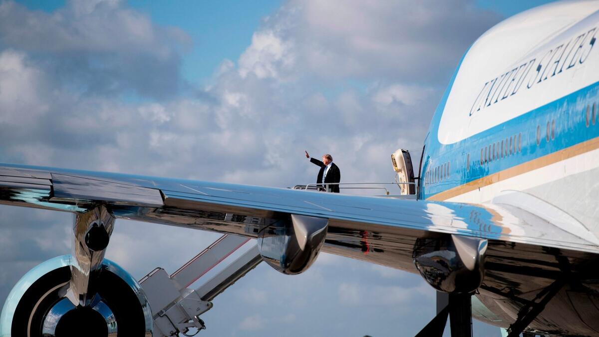 President Trump boards Air Force One at Palm Beach International Airport on Feb. 19.