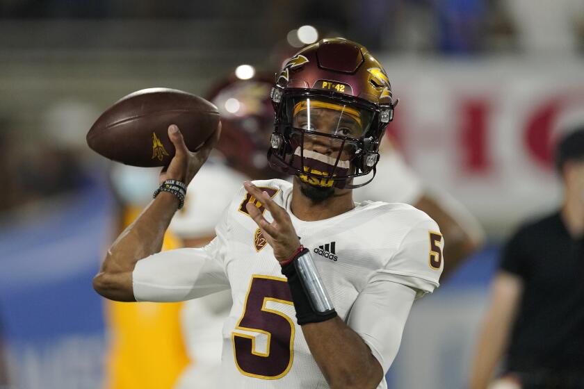 Arizona State quarterback Jayden Daniels warms up prior to an NCAA college football game against UCLA Saturday, Oct. 2, 2021, in Pasadena, Calif. (AP Photo/Mark J. Terrill)