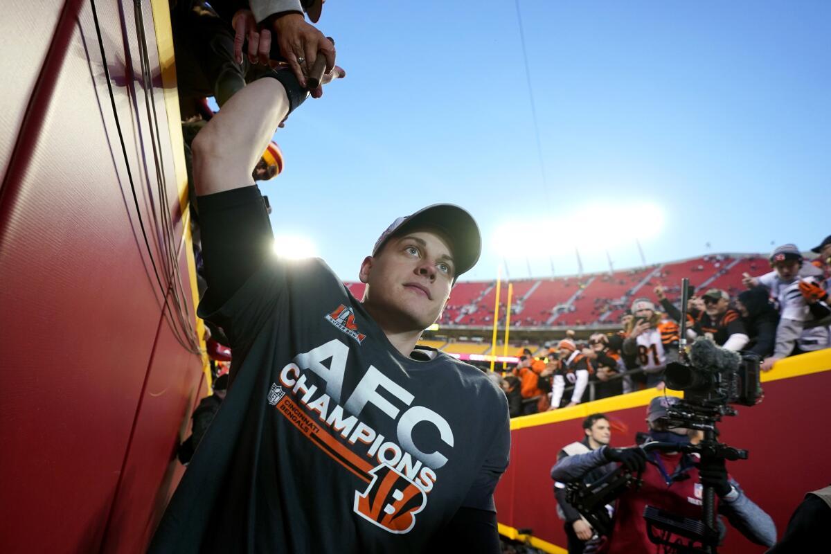 Cincinnati Bengals quarterback Joe Burrow celebrates with fans after beating the Kansas City Chiefs in the AFC title game.