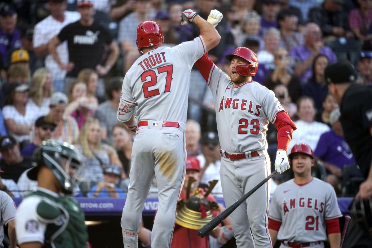 Los Angeles Angels' Mike Trout, right, celebrates his home run