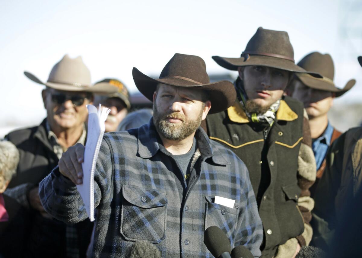 Ammon Bundy, center, at a news conference at Malheur National Wildlife Refuge on Jan. 8.