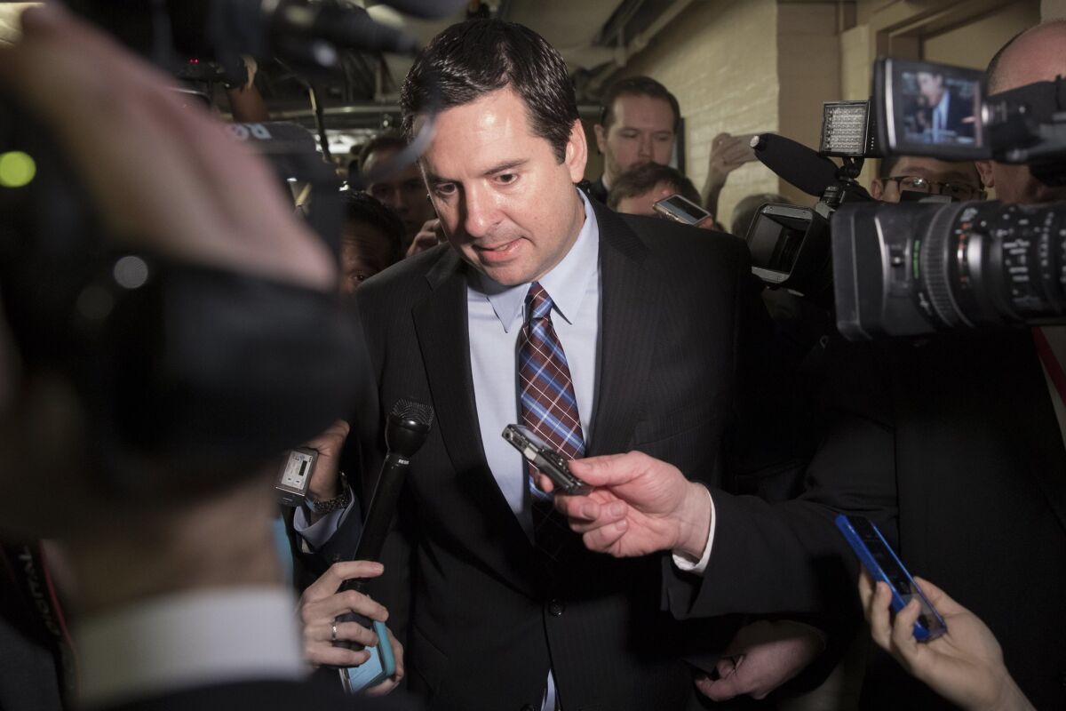 Chairman of the House Intelligence Committee Republican Devin Nunes is surrounded by members of the media after leaving a Republican conference meeting in Washington, D.C. on March 28.