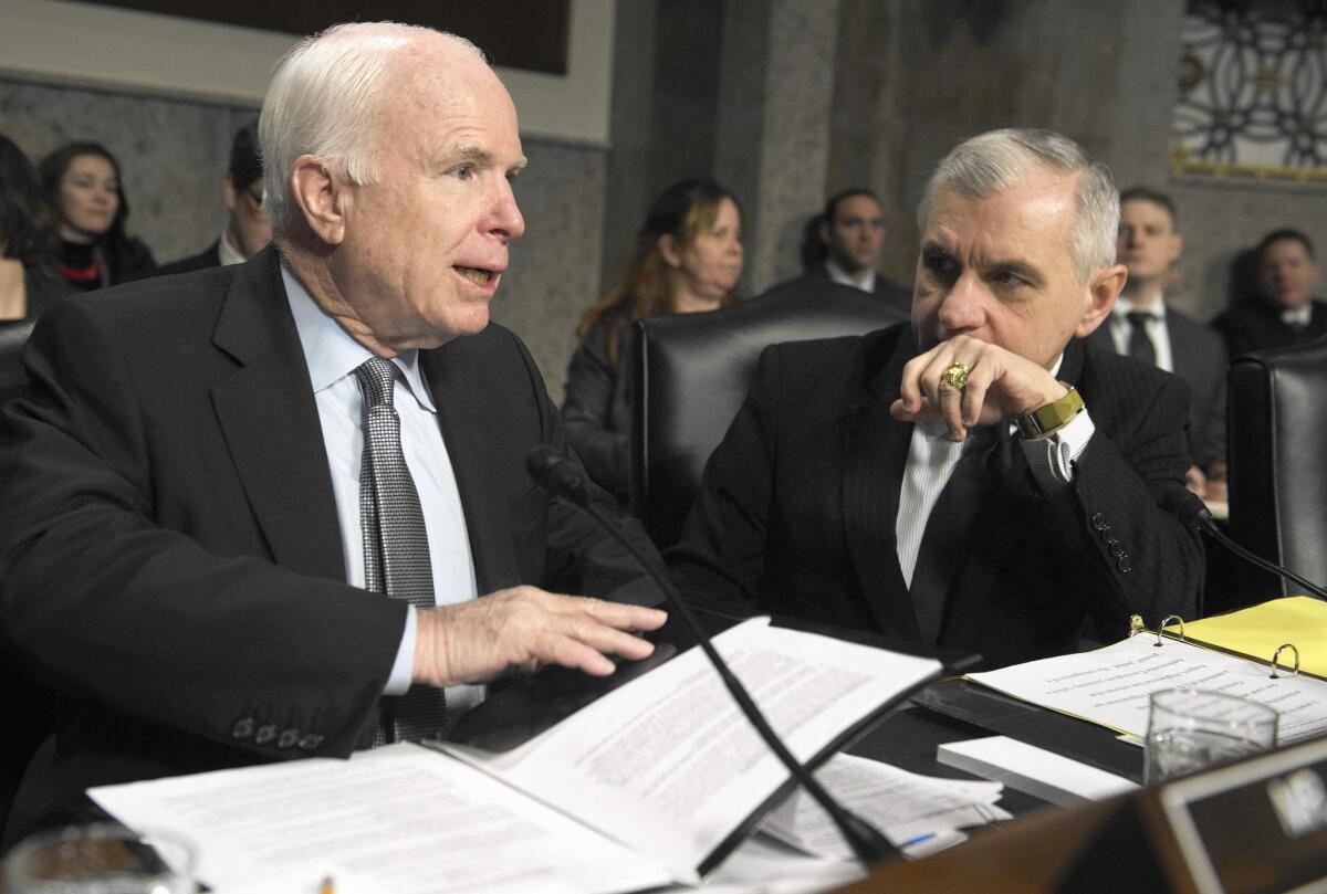 Sens. John McCain (R-Ariz.) and Jack Reed (D-R.I.) attend a hearing in February. McCain said President Obama's lack of respect for Congress’ prerogative in foreign affairs has led to a "poisoned environment."