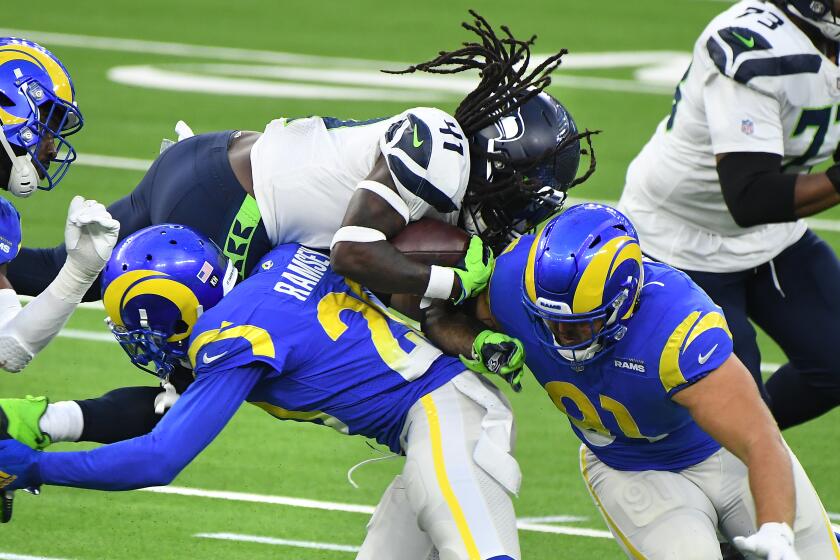 LOS ANGELES, CALIFORNIA NOVEMBER 15, 2020-Rams Jalen Ramsey, center, and Greg Gaines.