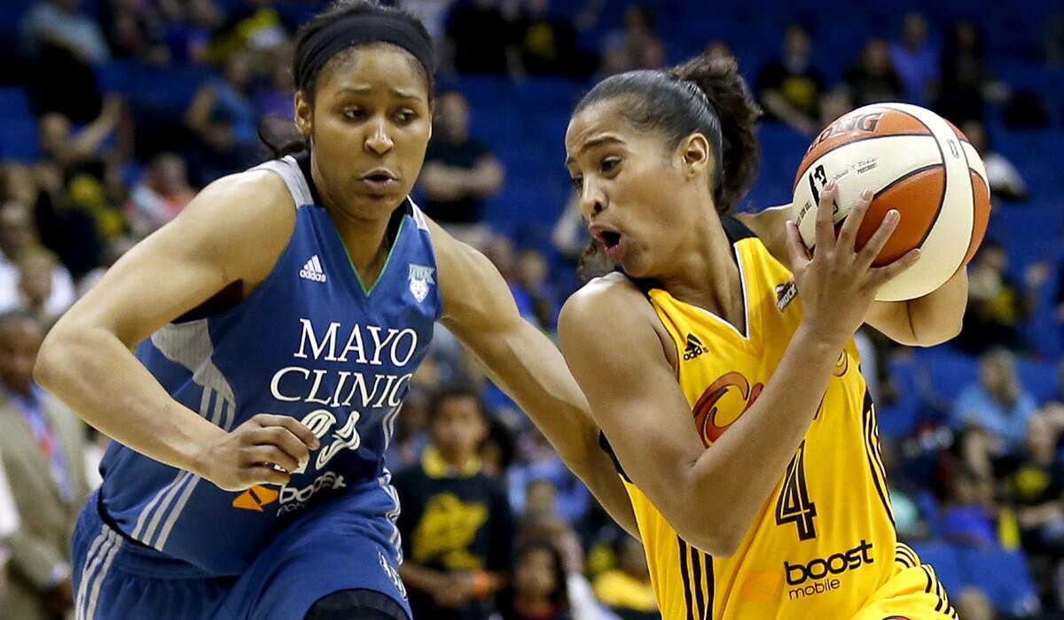 Tulsa guard Skylar Diggins drives against Lynx forward Maya Moore during a game last month in Tulsa.