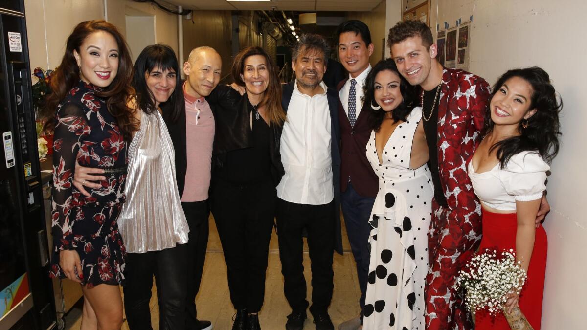 "Soft Power" cast member Jaygee Macapugay, from left, director Leigh Silverman, cast member Francis Jue, creators Jeanine Tesori and David Henry Hwang, cast members Austin Ku and Maria-Christina Oliveras, choreographer Sam Pinkleton and cast member Geena Quintos backstage.