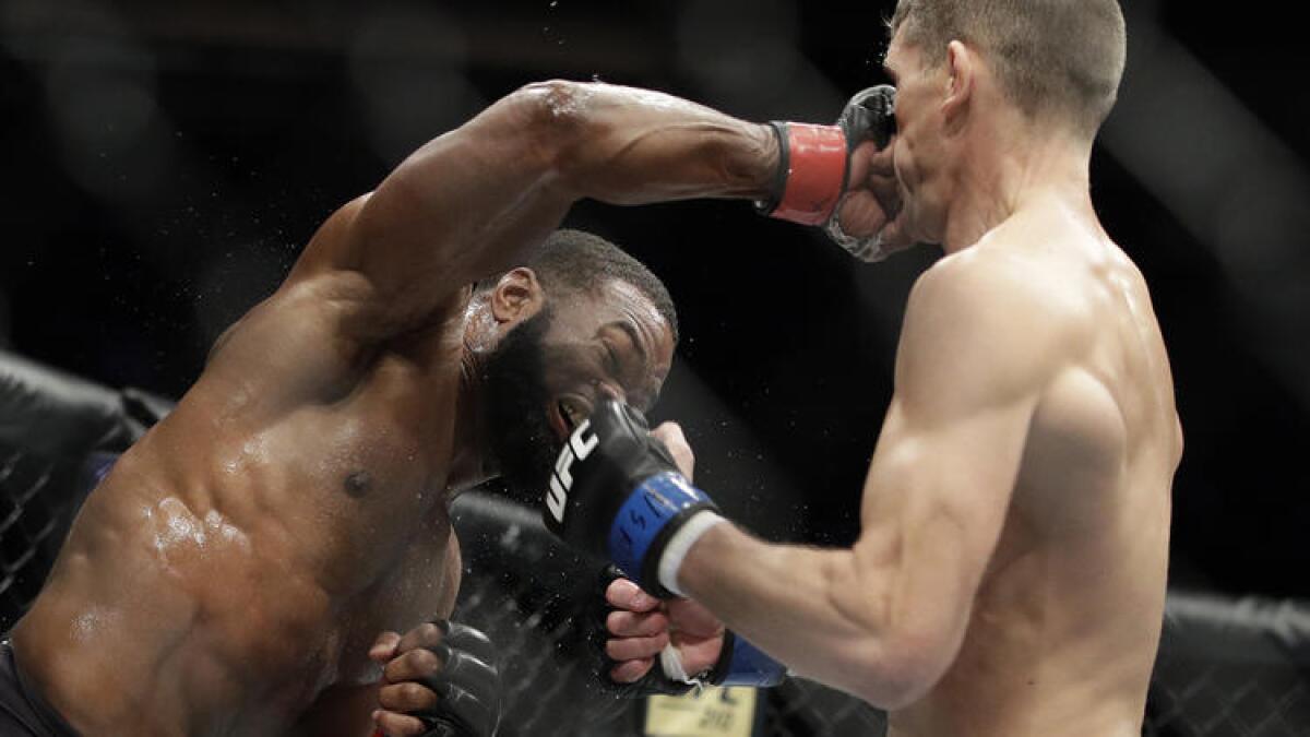 Tyron Woodley lands an overhand right flush to the face of Stephen Thompson during their welterweight title bout at UFC 209.