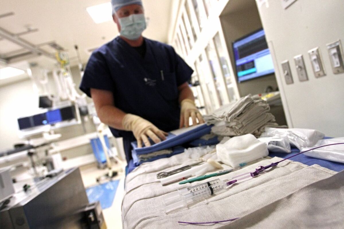 A technician prepares surgical trays for a procedure at Providence Little Company of Mary Hospital in Torrance in 2015.