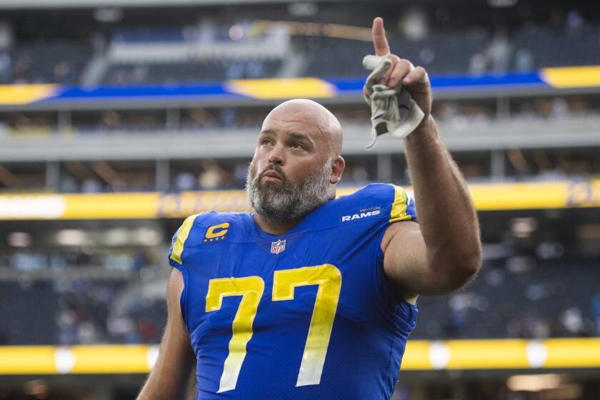Los Angeles Rams offensive tackle Andrew Whitworth (77) walks back to the locker room after the team defeats the Detroit Lions in an NFL football game Sunday, Oct. 24, 2021, in Inglewood, Calif. (AP Photo/Kyusung Gong)