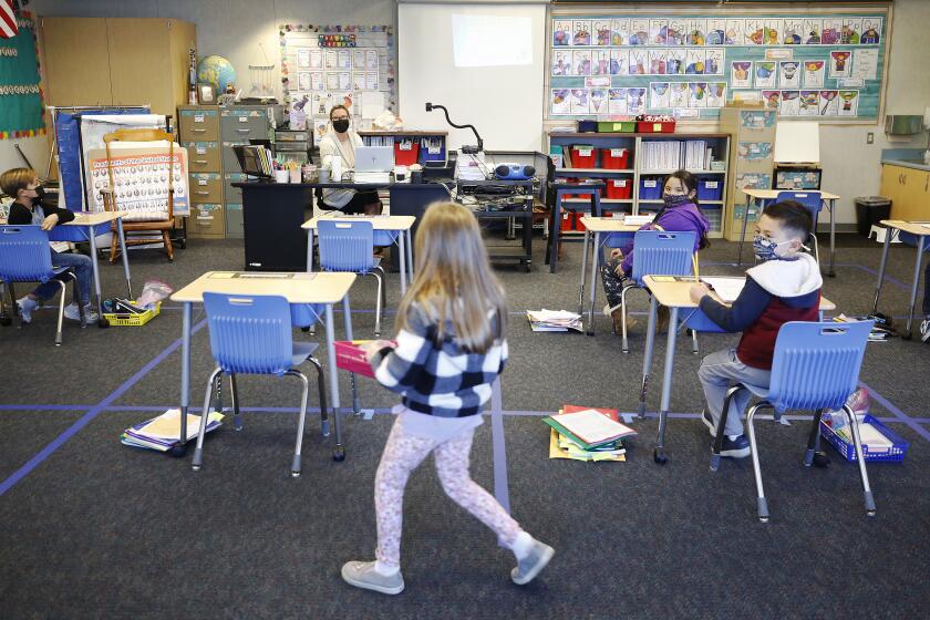 REDONDO BEACH, CA - FEBRUARY 02: The first grade classroom of teacher Courtney Meyer with desks separated for social distancing at Alta Vista Elementary School on the second day of classes as Redondo Beach Unified School district has welcomed back some of its K-2 students this week through a waiver. Alta Vista Elementary School on Tuesday, Feb. 2, 2021 in Redondo Beach, CA. (Al Seib / Los Angeles Times).