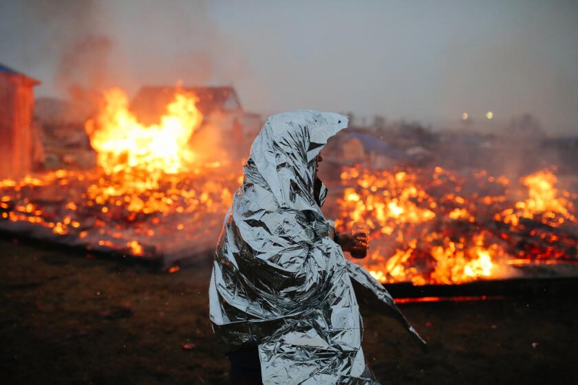 Campers set structures on fire in preparation of the deadline to leave the Oceti Sakowin protest camp on Feb. 22, 2017 in Cannon Ball, North Dakota.