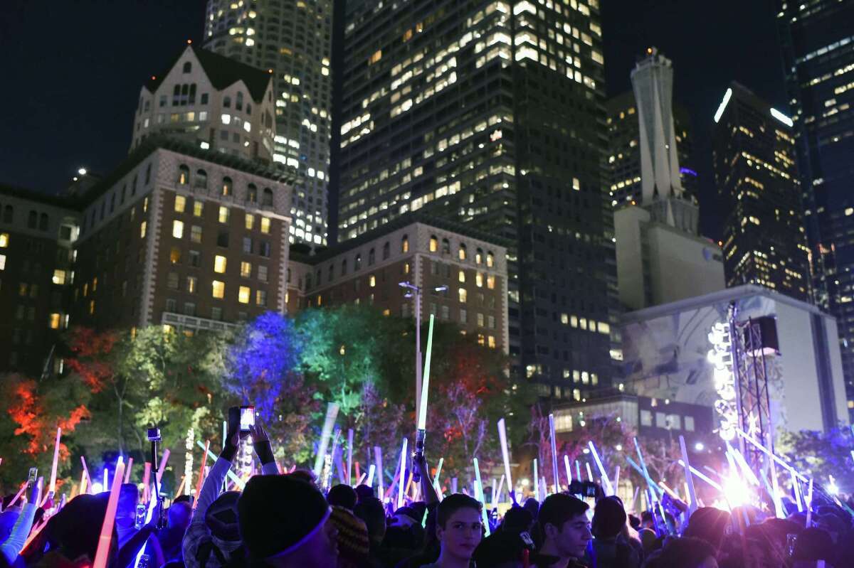 Thousands attend a lightsaber battle in downtown L.A.'s Pershing Square to celebrate the opening weekend of the new movie "Star Wars: The Force Awakens."