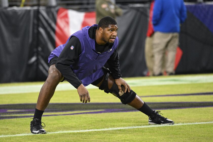 Baltimore Ravens defensive tackle Calais Campbell stretches during pre-game warm-ups before an NFL football game against the Pittsburgh Steelers, Jan. 1, 2023, in Baltimore. The Atlanta Falcons have agreed to terms on a one-year contract with free agent defensive end Calais Campbell, a person familiar with the negotiations told The Associated Press. Campbell, who played the last three seasons with the Ravens, has agreed to play the 2023 season in Atlanta, said the person, who spoke on condition of anonymity because the contract has not been signed. (AP Photo/Terrance Williams)