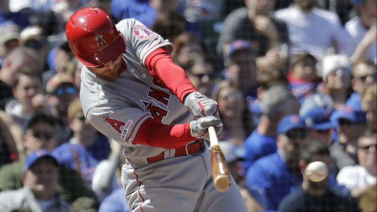 Angels' Zack Cozart hits an RBI single during the second inning against the Chicago Cubs on April 13 in Chicago.