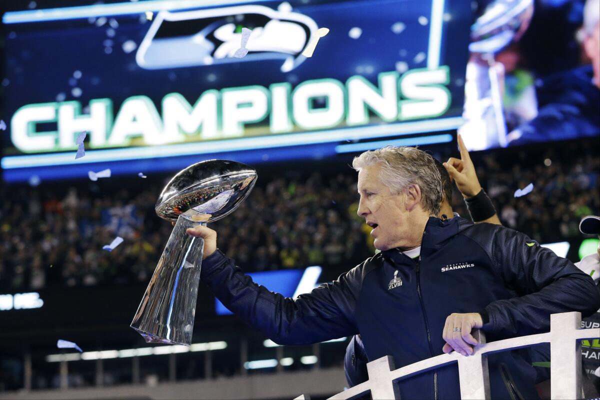 Seahawks Coach Pete Carroll holds the Lombardi Trophy after Seattle's 43-8 rout of the Denver Broncos in Super Bowl XLVIII on Feb. 2.