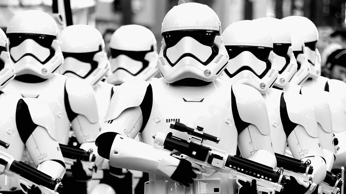 "OK, which one of you guys isn't nuts about the movie?" Stormtroopers arrive at the premiere of "Star Wars: The Force Awakens" on Monday.