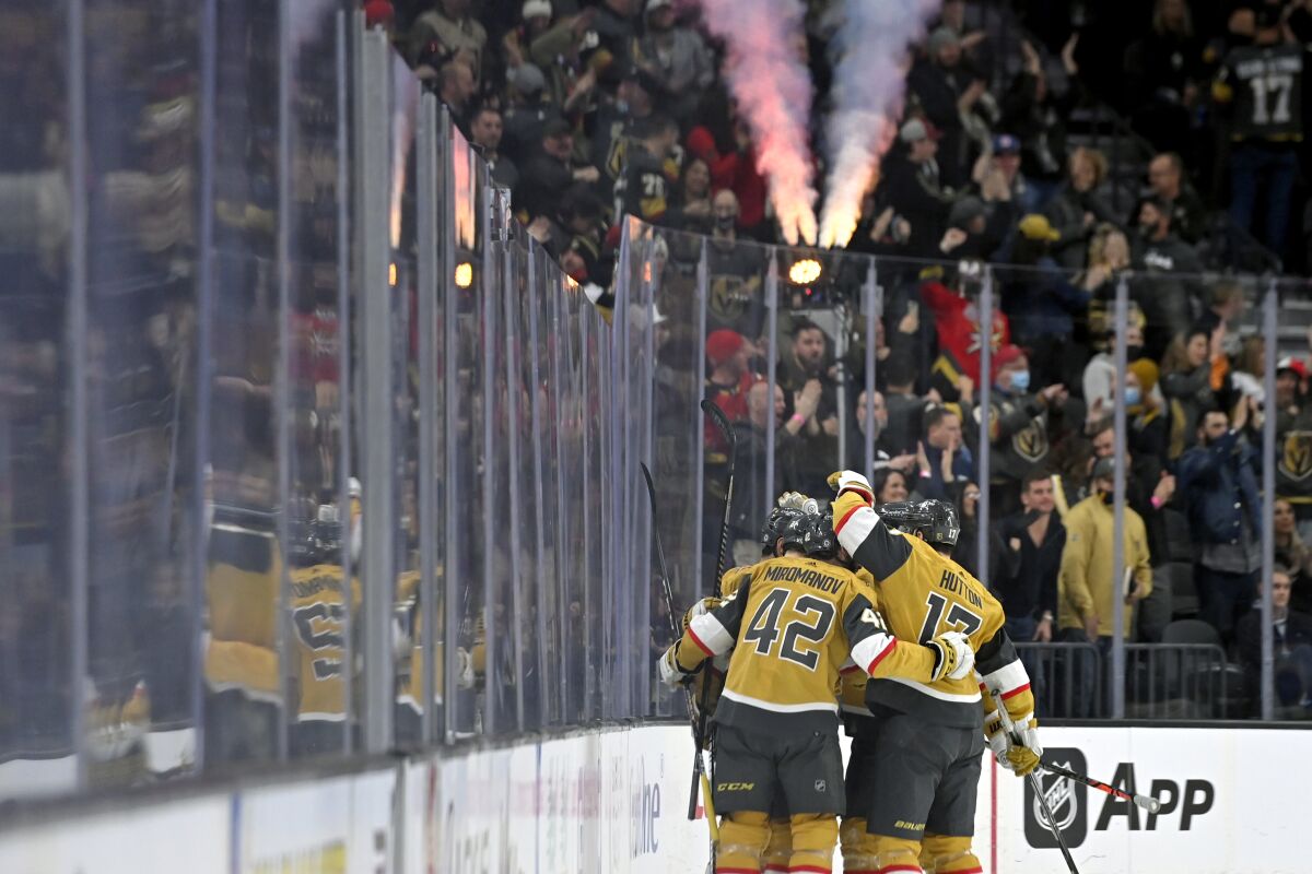 The Vegas Golden Knights celebrate a goal against the Buffalo Sabres during the first period of an NHL hockey game Tuesday, Feb. 1, 2022, in Las Vegas. (AP Photo/David Becker)