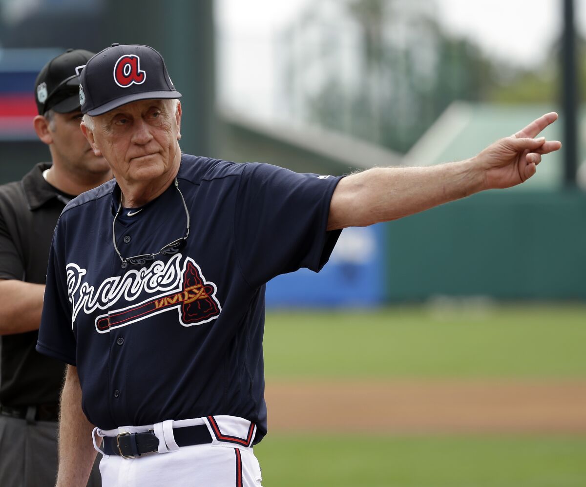 Former Major League Baseball pitcher Phil Niekro waves to fans in 2017.