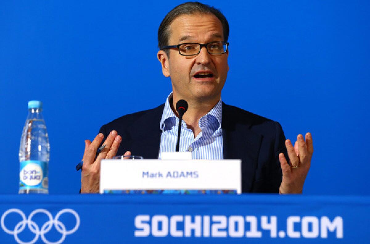 Mark Adams, the IOC's director of communications, conducts a press briefing Sunday in Sochi, Russia.