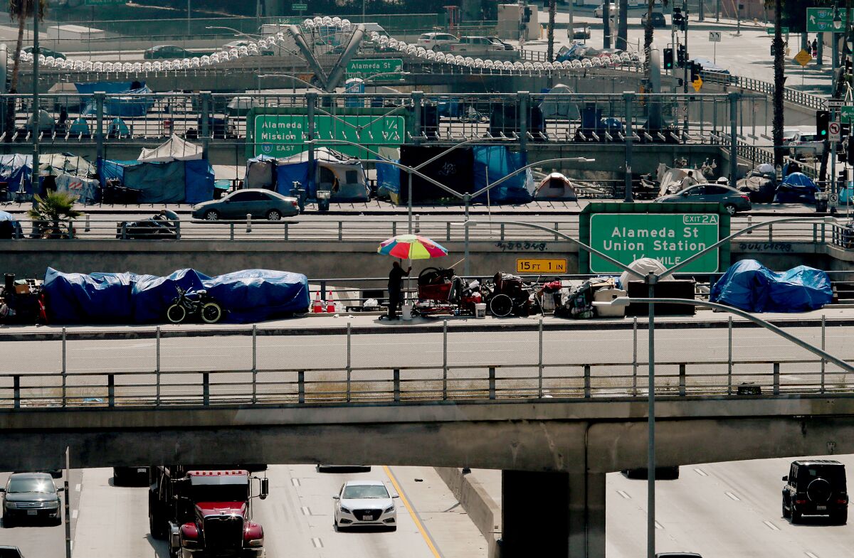 Homeless camps line Los Angeles, Main and Spring streets as they cross over the Hollywood Freeway in Los Angeles. 
