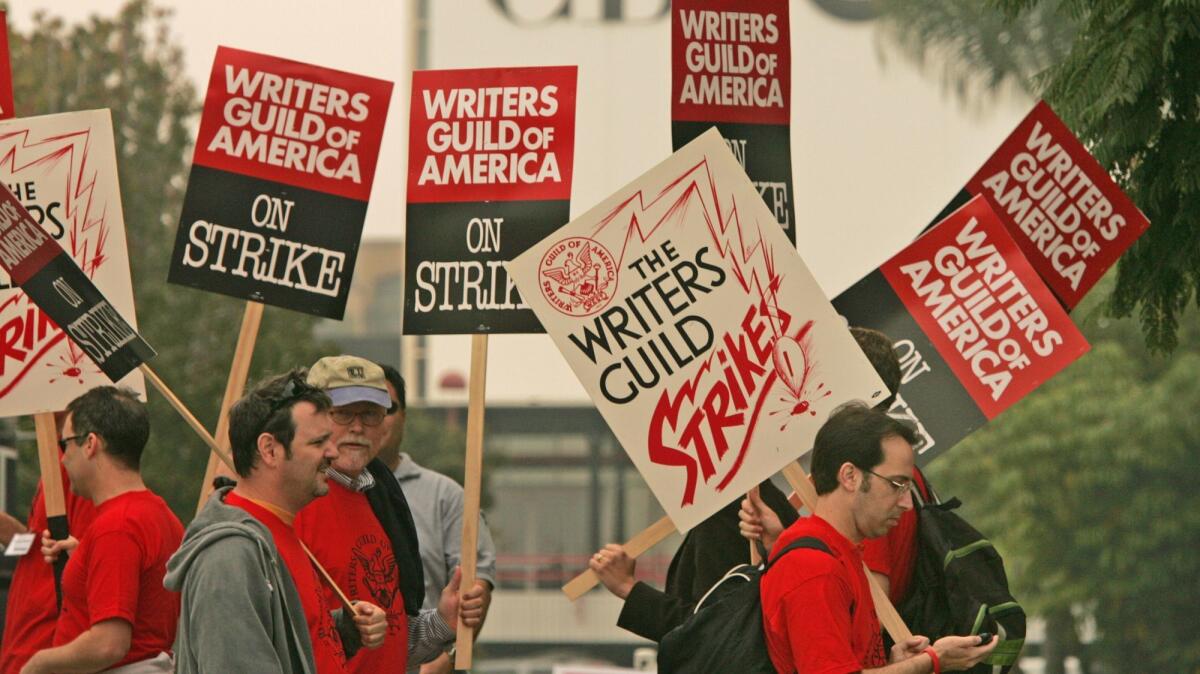 Writers Guild of America picketers march outside CBS Studios in Los Angeles in 2007.