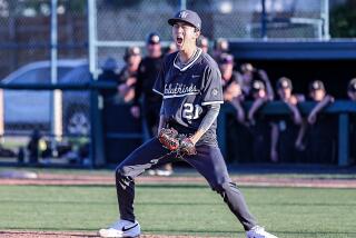 Jake Chung of Harvard-Westlake lets out a roar after a strikeout with the bases loaded against JSerra.