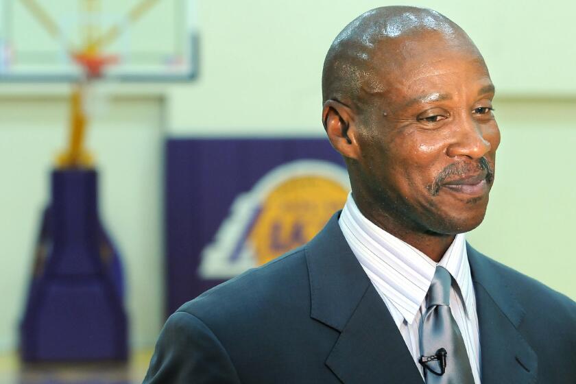 Lakers Coach Byron Scott looks on during his introductory news conference in July. The Lakers announced Scott's coaching staff Tuesday.