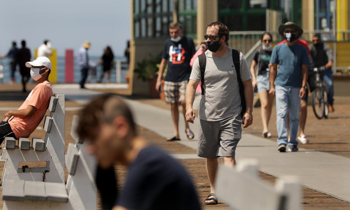 People visit the Santa Monica Pier on July 21.