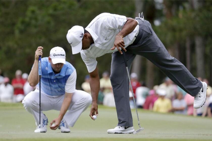 Tiger Woods, right, says of a spat involving Sergio Garcia that "it's time to move on."