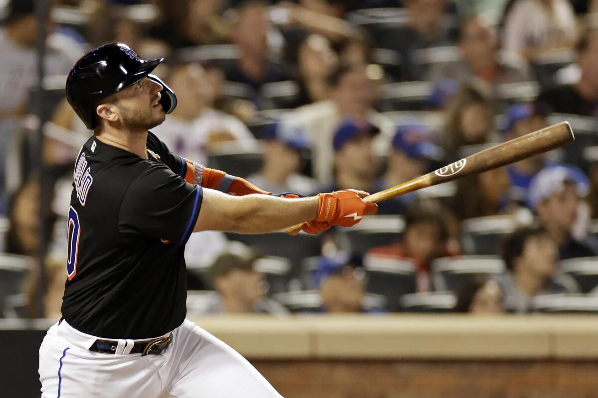 New York Mets' Pete Alonso watches his home run during the sixth inning of the team's baseball game against the Washington Nationals on Friday, Sept. 2, 2022, in New York. (AP Photo/Adam Hunger)