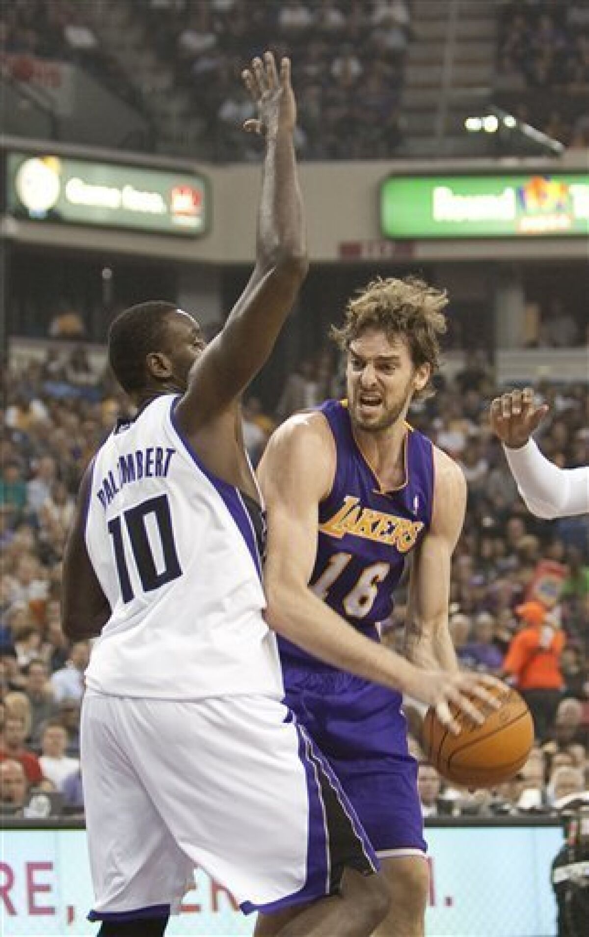 Los Angeles Lakers' Pau Gasol, right, tries to drive past the Sacramento Kings' Samuel Dalembert (10), right, in the first half, in Sacramento, Calif., Wednesday Nov. 3, 2010. (AP Photo/Robert Durell)